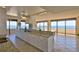 This open kitchen features a bar counter, granite countertops, and panoramic ocean views at 2200 N Atlantic Ave # 1201, Daytona Beach, FL 32118