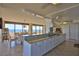 Bright, spacious kitchen with granite countertops, pendant lights, and stunning ocean views at 2200 N Atlantic Ave # 1201, Daytona Beach, FL 32118