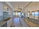 Bright kitchen with white cabinetry, granite countertops, and expansive views of the ocean at 2200 N Atlantic Ave # 1201, Daytona Beach, FL 32118