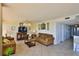 Comfortable living area with tiled floors, neutral decor and ample natural light at 2200 N Atlantic Ave # 1201, Daytona Beach, FL 32118