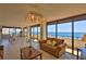 Inviting living space with floor-to-ceiling windows offering ocean views at 2200 N Atlantic Ave # 1201, Daytona Beach, FL 32118