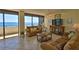 Cozy living room with comfy seating, tiled floors, and spectacular ocean views at 2200 N Atlantic Ave # 1201, Daytona Beach, FL 32118