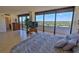 Spacious bedroom featuring tiled floors, balcony access, and views of the intracoastal waterway at 2200 N Atlantic Ave # 1201, Daytona Beach, FL 32118