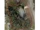 Aerial shot of the property showing the layout, surrounding greenery, and neighborhood at 2240 Conway Dr, Deltona, FL 32738