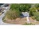 Aerial view of house on corner lot, shaded by mature trees at 2240 Conway Dr, Deltona, FL 32738