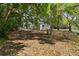 Expansive backyard area featuring lush trees and shaded space, perfect for outdoor enjoyment at 2240 Conway Dr, Deltona, FL 32738