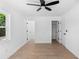 Bright bedroom with fresh paint, laminate floors, ceiling fan, and closet at 2240 Conway Dr, Deltona, FL 32738