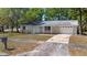 Single-story home with landscaped lawn and driveway at 2240 Conway Dr, Deltona, FL 32738