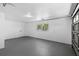 Spacious garage with concrete floor, window, and overhead door track at 2240 Conway Dr, Deltona, FL 32738