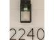 Close-up of the house number 2240 on the exterior of the home with light fixture at 2240 Conway Dr, Deltona, FL 32738
