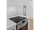 Modern kitchen island features sleek electric cooktop and stainless steel oven at 2240 Conway Dr, Deltona, FL 32738