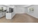 Bright living room with hardwood floors, fresh paint, open kitchen, and natural light at 2240 Conway Dr, Deltona, FL 32738