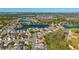 This aerial view shows the home's convenient location near lakes and mature trees at 2274 Stonehedge Loop, Kissimmee, FL 34743