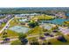 Community park view showcasing tennis courts, a basketball court, an ice rink, and a recreational area by a pond at 2274 Stonehedge Loop, Kissimmee, FL 34743