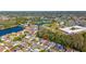 An aerial view showcases this neighborhood with scenic ponds and lush green landscaping at 2274 Stonehedge Loop, Kissimmee, FL 34743