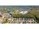 This aerial view shows the property near a school and community green space at 2274 Stonehedge Loop, Kissimmee, FL 34743