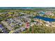 An aerial view highlights the neighborhood's proximity to a beautiful lake at 2274 Stonehedge Loop, Kissimmee, FL 34743