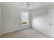 Bedroom featuring a ceiling fan, wall to wall carpet and a window at 2274 Stonehedge Loop, Kissimmee, FL 34743