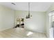 Dining area with chandelier and sliding door to a screened-in patio at 2274 Stonehedge Loop, Kissimmee, FL 34743