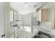 Bright kitchen with white appliances, tile flooring, and ample counter space at 2274 Stonehedge Loop, Kissimmee, FL 34743
