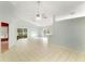 Spacious living room with tile floors, ceiling fan, and sliding glass doors to the lanai at 2274 Stonehedge Loop, Kissimmee, FL 34743