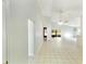 Bright, open living room featuring tile flooring and access to an enclosed lanai at 2274 Stonehedge Loop, Kissimmee, FL 34743