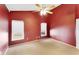 Spacious main bedroom featuring carpet and dual windows at 2274 Stonehedge Loop, Kissimmee, FL 34743