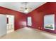Spacious main bedroom featuring carpet, a ceiling fan, and an ensuite bathroom at 2274 Stonehedge Loop, Kissimmee, FL 34743