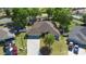Beautiful aerial view of home with spacious yard and driveway at 2301 Angel Fish Loop, Leesburg, FL 34748