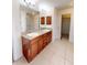 Spacious bathroom with double granite vanity and shower at 2301 Angel Fish Loop, Leesburg, FL 34748