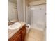 Bathroom featuring walk-in shower and granite vanity at 2301 Angel Fish Loop, Leesburg, FL 34748