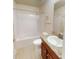 Well-lit bathroom with a tub and shower combination at 2301 Angel Fish Loop, Leesburg, FL 34748