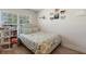 Charming bedroom with a cozy bed and personalized wall decorations at 2301 Angel Fish Loop, Leesburg, FL 34748