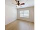 Inviting bedroom featuring a ceiling fan and a bright window at 2301 Angel Fish Loop, Leesburg, FL 34748