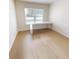 This room features a built in desk, and a large window at 2301 Angel Fish Loop, Leesburg, FL 34748