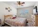 Comfortable bedroom with neutral walls and a ceiling fan offering a relaxing and inviting atmosphere at 2301 Angel Fish Loop, Leesburg, FL 34748