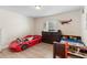 Fun bedroom with a car-shaped bed and playful decor at 2301 Angel Fish Loop, Leesburg, FL 34748