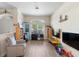 Bright, airy living room with wood flooring and a comfortable seating area at 2301 Angel Fish Loop, Leesburg, FL 34748