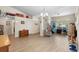 Spacious living area with wood floors, ample natural light, and a comfortable seating arrangement at 2301 Angel Fish Loop, Leesburg, FL 34748