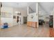 Open-concept living area with wood floors, ample space, and stylish decor at 2301 Angel Fish Loop, Leesburg, FL 34748