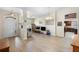 Bright, spacious living area with wood floors, multiple televisions, and an open layout at 2301 Angel Fish Loop, Leesburg, FL 34748