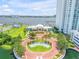 Aerial view of the complex, including lush landscaping and waterfront at 241 Riverside Dr # 601, Daytona Beach, FL 32117