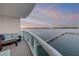 Waterfront balcony with comfortable seating offers stunning sunset views and a relaxing outdoor living space at 241 Riverside Dr # 601, Daytona Beach, FL 32117