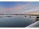Condo balcony overlooking water with docks and views of bridge and skyline at 241 Riverside Dr # 601, Daytona Beach, FL 32117