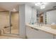 A bright bathroom features a large, glass-enclosed shower with a built-in bench at 241 Riverside Dr # 601, Daytona Beach, FL 32117