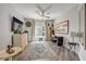 Bright bedroom with a ceiling fan, modern decor, and large windows at 241 Riverside Dr # 601, Daytona Beach, FL 32117