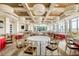 Banquet room with elegant round tables, chairs, and bright natural lighting at 241 Riverside Dr # 601, Daytona Beach, FL 32117