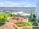 Stunning waterfront clubhouse with a circular brick driveway, manicured landscaping, and gorgeous water views at 241 Riverside Dr # 601, Daytona Beach, FL 32117