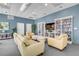 Cozy community room with comfortable seating, bookshelves, and a large-screen television at 241 Riverside Dr # 601, Daytona Beach, FL 32117