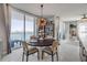 Waterfront dining area featuring a round table with seating, a wine rack, and floor to ceiling windows at 241 Riverside Dr # 601, Daytona Beach, FL 32117